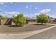 Charming brick home featuring a well-kept yard, solar panels, and mature citrus trees at 3002 E Montecito Ave, Phoenix, AZ 85016