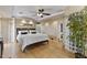 Serene main bedroom featuring a ceiling fan, recessed lighting, and light hardwood flooring at 3002 E Montecito Ave, Phoenix, AZ 85016