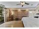 Bright bedroom with a ceiling fan, wood floors, and access to ensuite bathroom and closet at 3002 E Montecito Ave, Phoenix, AZ 85016