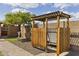 Relax in this outdoor shower with a wooden privacy screen, set on a stone base and accented with a pergola at 3002 E Montecito Ave, Phoenix, AZ 85016
