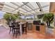 Covered patio features a built-in BBQ, mini fridge and a ceiling fan for comfortable outdoor cooking at 3002 E Montecito Ave, Phoenix, AZ 85016