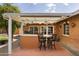 Outdoor patio with bar and seating with orange tree at 3002 E Montecito Ave, Phoenix, AZ 85016