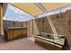 Outdoor patio featuring a hot tub and unique decor at 3002 E Montecito Ave, Phoenix, AZ 85016