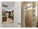 A bright walk in shower featuring stone tile, glass block accents, and a curtain for privacy at 3002 E Montecito Ave, Phoenix, AZ 85016
