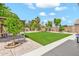 Beautiful backyard featuring lush artificial turf and a cozy pergola, perfect for outdoor entertaining at 3044 E Sparrow Pl, Chandler, AZ 85286