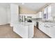 Bright and airy kitchen featuring white cabinets, stainless steel appliances, and a center island at 3044 E Sparrow Pl, Chandler, AZ 85286