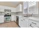 Well-equipped kitchen with stainless steel appliances, ample counter space, and tile backsplash at 3044 E Sparrow Pl, Chandler, AZ 85286
