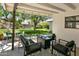 Shaded backyard patio featuring modern outdoor furniture, a fire pit, and a lush lawn with a hammock at 3115 N 34Th Pl, Phoenix, AZ 85018