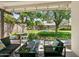 Covered backyard patio with comfortable seating, a fire pit, and a view of the lush, green backyard at 3115 N 34Th Pl, Phoenix, AZ 85018