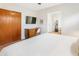 Comfortable bedroom area includes a desk, a wardrobe, and access to a chic bathroom at 3115 N 34Th Pl, Phoenix, AZ 85018