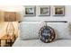 Closeup of bedroom pillows with wall art and a decorative lamp on the bedside table at 3115 N 34Th Pl, Phoenix, AZ 85018