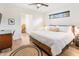 Light-filled bedroom with hardwood floors, a ceiling fan, and a warm color palette at 3115 N 34Th Pl, Phoenix, AZ 85018