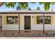 Charming single-story home featuring a secure front door and vibrant yellow shutters at 3115 N 34Th Pl, Phoenix, AZ 85018