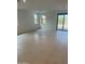 Bright and open living room featuring tile floors and large windows for natural light at 31274 N 130Th Ave, Peoria, AZ 85383