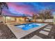 A refreshing backyard oasis featuring a sparkling pool and a peaceful outdoor area perfect for relaxation and entertainment at 317 E Belmont Ave, Phoenix, AZ 85020