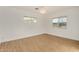 Bright bedroom with wood floors and chandelier at 317 E Belmont Ave, Phoenix, AZ 85020
