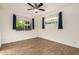 Bright bedroom with wood floors and two windows at 317 E Belmont Ave, Phoenix, AZ 85020