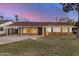 Charming single-story home with a well-maintained lawn and a convenient carport, nestled in a quiet neighborhood at 317 E Belmont Ave, Phoenix, AZ 85020