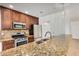 Beautiful kitchen featuring stainless steel appliances, granite countertops, and ample cabinet space at 317 E Belmont Ave, Phoenix, AZ 85020