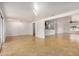 Spacious living room with tiled floors, open layout, and easy access to the kitchen, perfect for entertaining at 317 E Belmont Ave, Phoenix, AZ 85020
