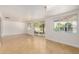 Open living area with sliding glass doors to the backyard, tiled floors, and abundant natural light at 317 E Belmont Ave, Phoenix, AZ 85020