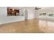 Open-concept living area with tiled floors, modern lighting, and seamless flow into the adjacent kitchen at 317 E Belmont Ave, Phoenix, AZ 85020