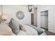 Bright bedroom boasts a modern light fixture, a decorative mirror and a closet at 35815 N King Ln, San Tan Valley, AZ 85140