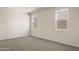 Bedroom with carpet, neutral walls and two windows letting in natural light at 35815 N King Ln, San Tan Valley, AZ 85140
