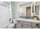 Bathroom features a vanity with white countertop, shower/tub with a shower curtain at 3648 E Fargo St, Mesa, AZ 85205