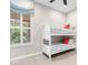 Bedroom features a white bunk bed and a window with plantation shutters at 3648 E Fargo St, Mesa, AZ 85205