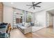 Living space is spacious with oversized sofa, lots of natural light, and neutral decor at 3648 E Fargo St, Mesa, AZ 85205