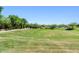 Beautifully landscaped community park featuring lush green grass, mature trees and walking paths at 3648 E Fargo St, Mesa, AZ 85205
