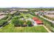 Aerial view of a neighborhood park with play areas, picnic pavilions and lots of grassy areas at 3648 E Fargo St, Mesa, AZ 85205