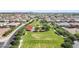 Community park aerial view with green space, play structures and a paved walking path at 3648 E Fargo St, Mesa, AZ 85205