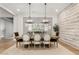 Formal dining room with decorative lighting, wood floors, and seating for six at 3648 E Fargo St, Mesa, AZ 85205