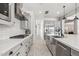 Spacious kitchen featuring stainless steel appliances, a gas cooktop, subway tile backsplash, and ample counter space at 3648 E Fargo St, Mesa, AZ 85205