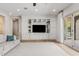 Living room featuring custom built-ins, hardwood floors, and ample storage space at 3648 E Fargo St, Mesa, AZ 85205
