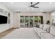 Bright living room with sliding glass doors, built-in shelving, and a comfortable sofa at 3648 E Fargo St, Mesa, AZ 85205