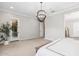Open main bedroom with decorative chandelier, neutral wall colors, and access to the en suite bathroom at 3648 E Fargo St, Mesa, AZ 85205