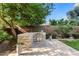 Outdoor kitchen boasts a built-in grill, stone counters, and a cozy patio area for entertaining at 3648 E Fargo St, Mesa, AZ 85205