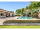 A refreshing pool provides a serene escape with ample patio space and lush tropical landscaping at 3648 E Fargo St, Mesa, AZ 85205