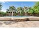 Inviting backyard pool features travertine decking, lush landscaping, and tranquil fountains at 3648 E Fargo St, Mesa, AZ 85205