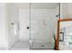The marble-tiled shower features a frameless glass enclosure and dual shower heads at 3648 E Fargo St, Mesa, AZ 85205