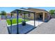 Cozy backyard with a gazebo, artificial grass, and a seating area, perfect for outdoor enjoyment at 38086 W Isabella Ln, Maricopa, AZ 85138