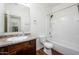 Full bathroom featuring a shower/tub combo and wooden vanity at 38086 W Isabella Ln, Maricopa, AZ 85138