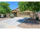 Inviting single-Gathering home boasting a well-maintained lawn, long driveway, and appealing exterior at 38086 W Isabella Ln, Maricopa, AZ 85138