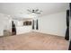 Spacious living room featuring neutral walls and an open concept floor plan at 38086 W Isabella Ln, Maricopa, AZ 85138