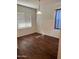 Bright, spacious room featuring hard surface floors, neutral walls, and large window for natural light at 38086 W Isabella Ln, Maricopa, AZ 85138