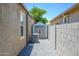 Side yard featuring a shed and a gravel area at 38086 W Isabella Ln, Maricopa, AZ 85138