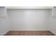 Empty carpeted walk-in closet with shelves and rack space perfect for organizing clothes at 38086 W Isabella Ln, Maricopa, AZ 85138